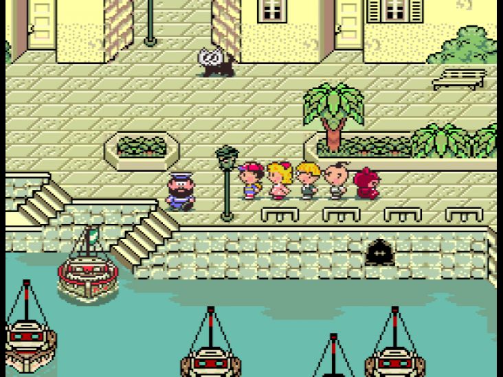 Ness and his friends prepare to depart from the port town of Toto to reach Scaraba.