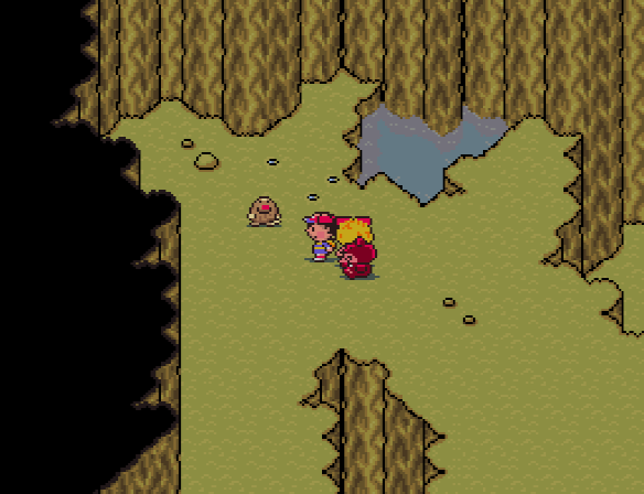 Ness and Paula prepare to battle a mole in Lilliput Steps. Ness and Paula prepare to battle a mole in Lilliput Steps.