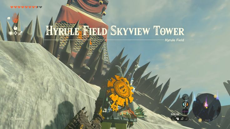 The Hyrule Field Skyview Tower is behind the walls of a Bokoblin and Moblin encampment.